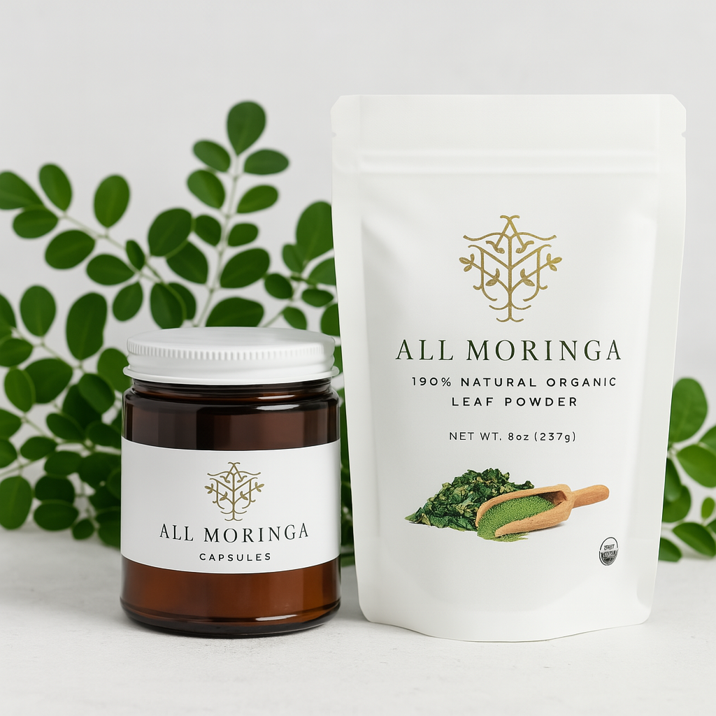All Moringa official products – organic Moringa capsules and leaf powder pouch with gold logo, photographed with real moringa leaves to represent clean, authentic wellness.
