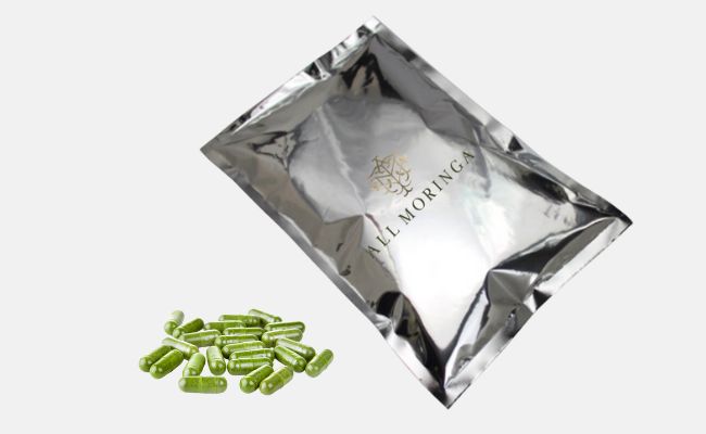 Moringa powder capsules in a refill bag