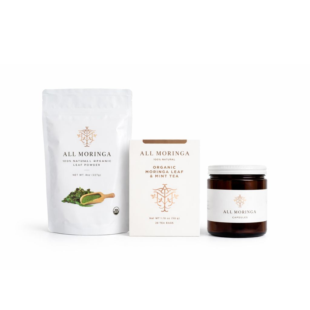 Organic moringa tea and powder duo featuring moringa leaf powder, herbal tea, and capsules.