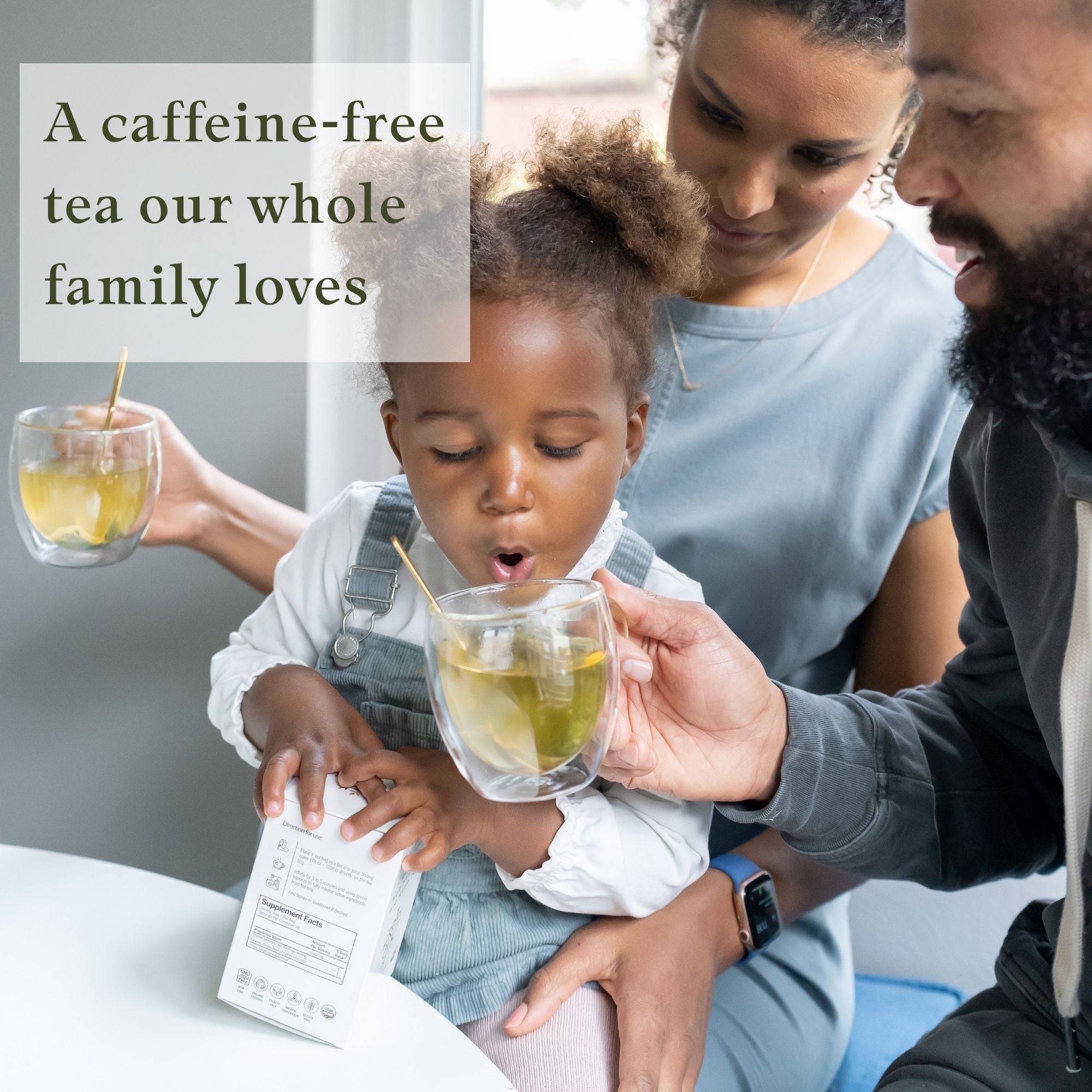 Family with a child holding a cup of moringa ginger tea with text about a caffeine-free tea.