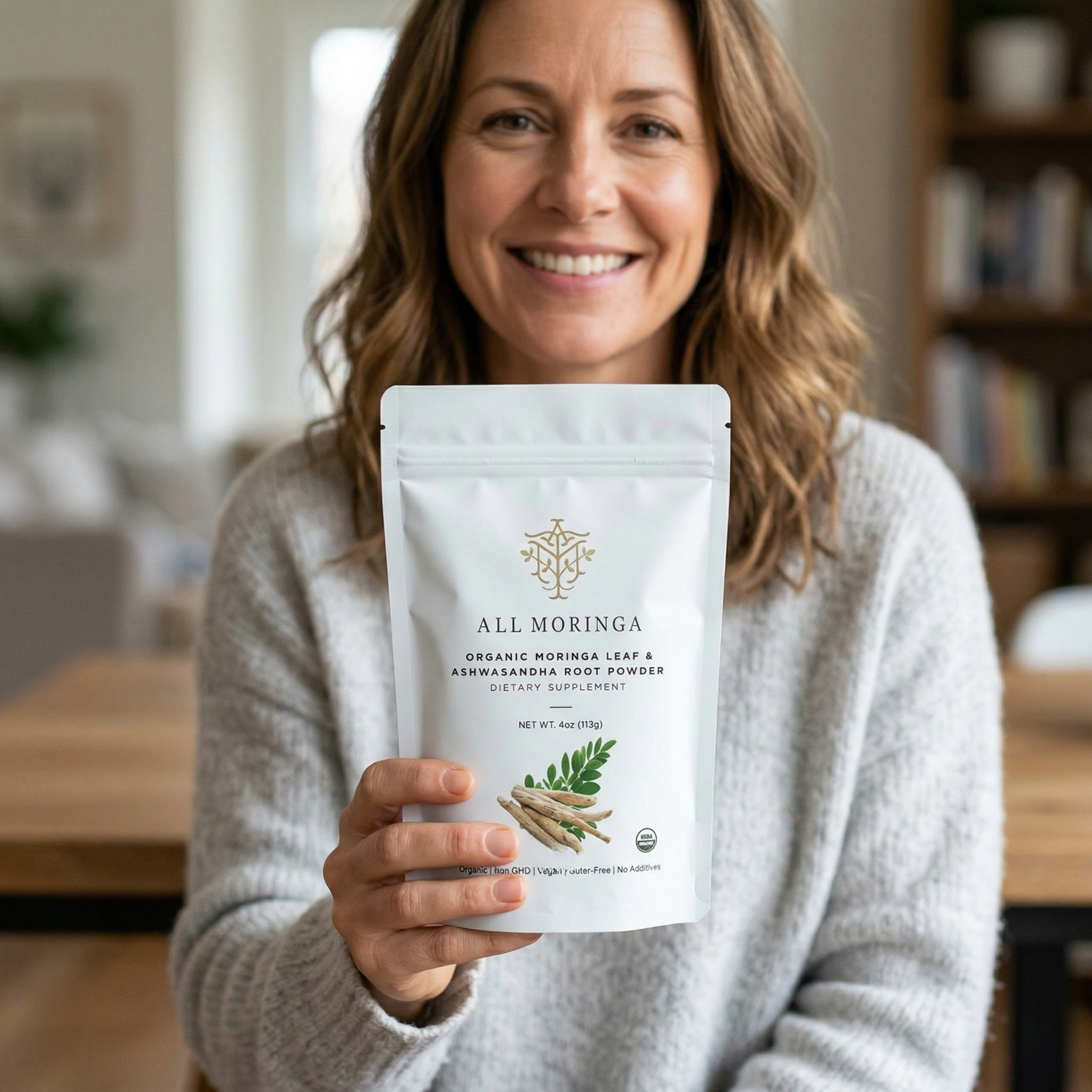 woman holding moringa and ashwagandha pouch