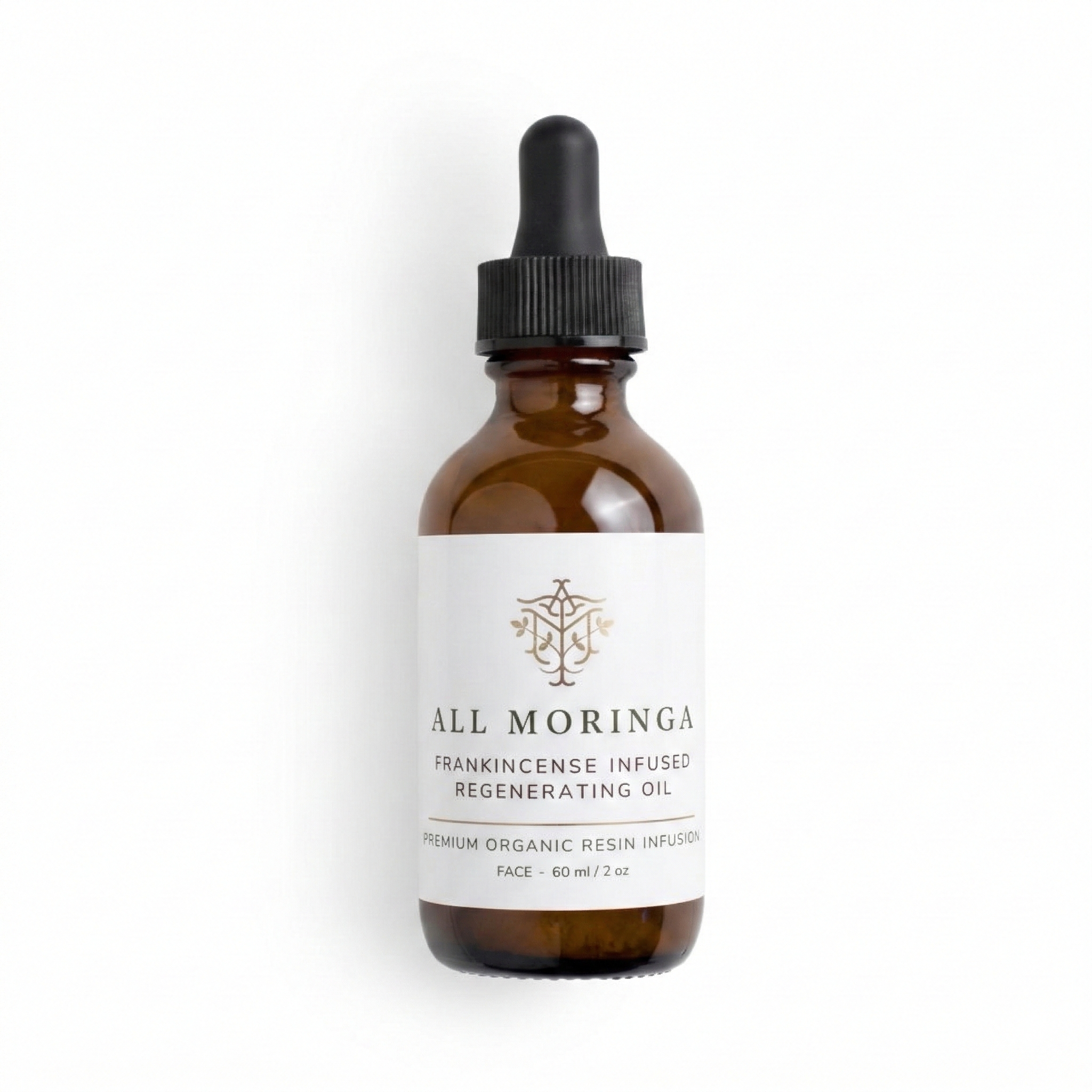 Brown glass bottle with dropper labeled Moringa & Frankincense Regenerating Treatment Oil on a white background