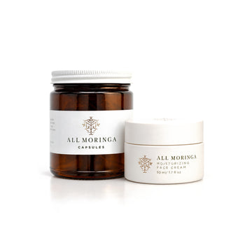 Moringa Face Cream & Leaf Capsules Duo: moringa leaf capsules jar and moisturizing face cream 50 ml on white