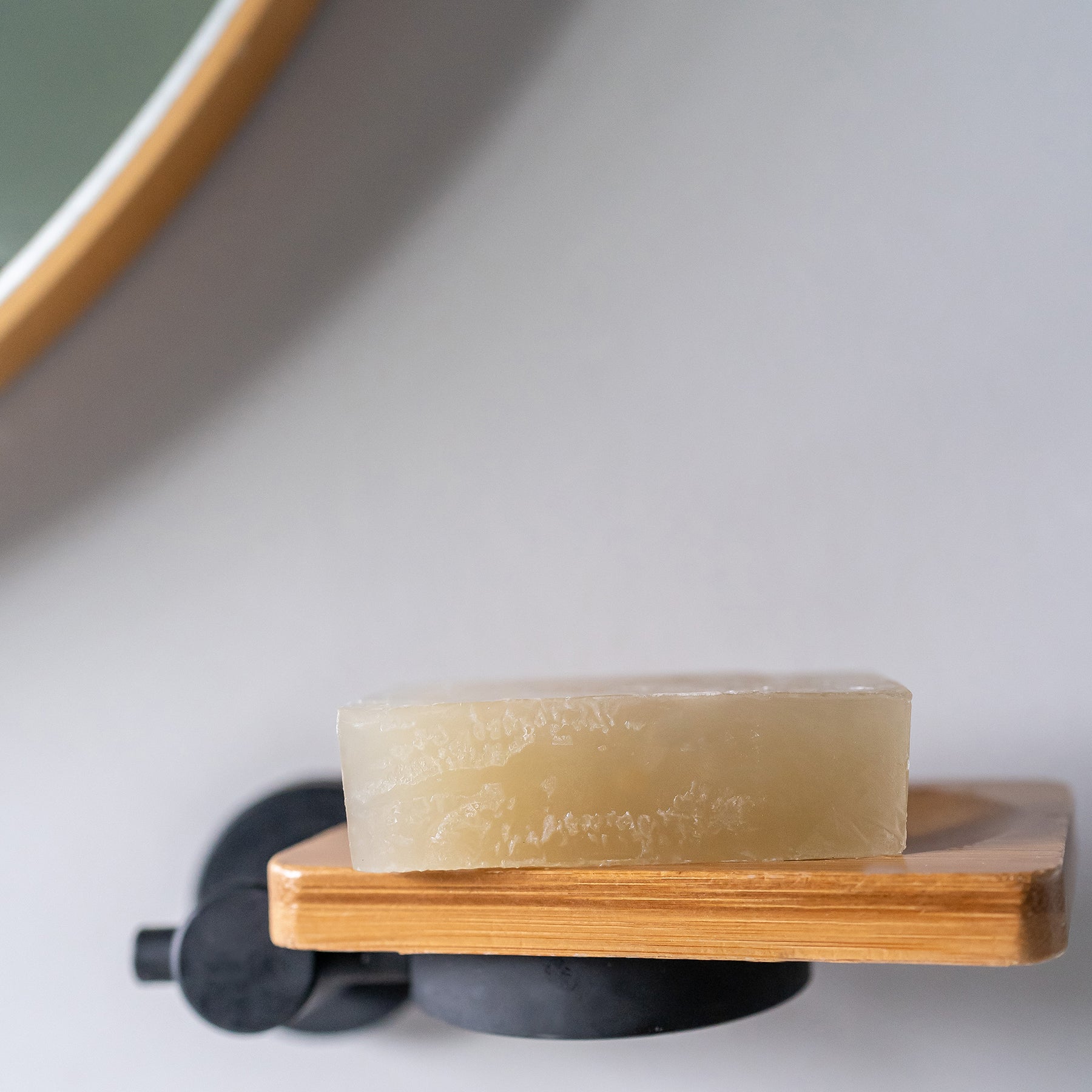 Moringa soap bar on wooden soap dish